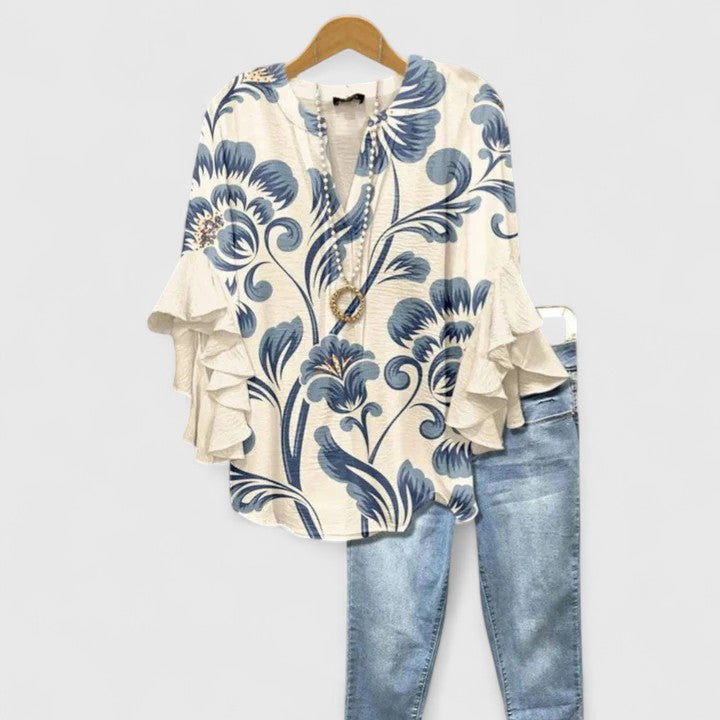 Women's chic floral blouse with ruffled long sleeves, perfect for versatile spring and summer fashion.