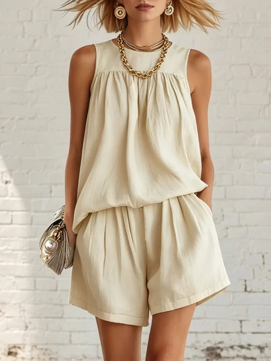 Women's chic gathered sleeveless top & high-waisted shorts two-piece set. Perfect casual summer outfit.