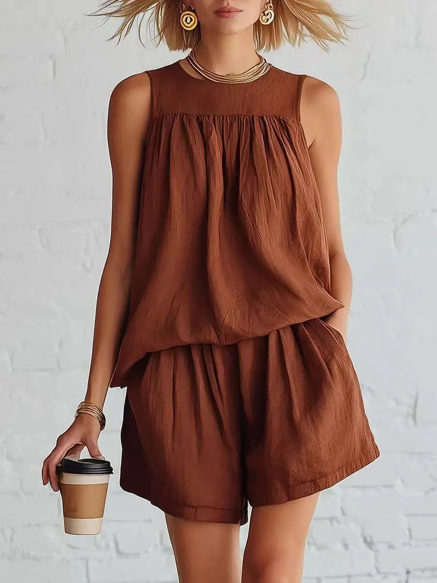 Chic women's two-piece ensemble: gathered sleeveless top & high-waisted shorts. Perfect for casual summer wear.