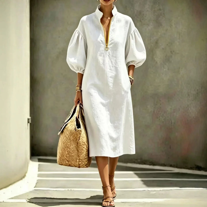 Casual chic women's midi dress featuring a half-zip and trendy bubble sleeves, great for spring/summer fashion.