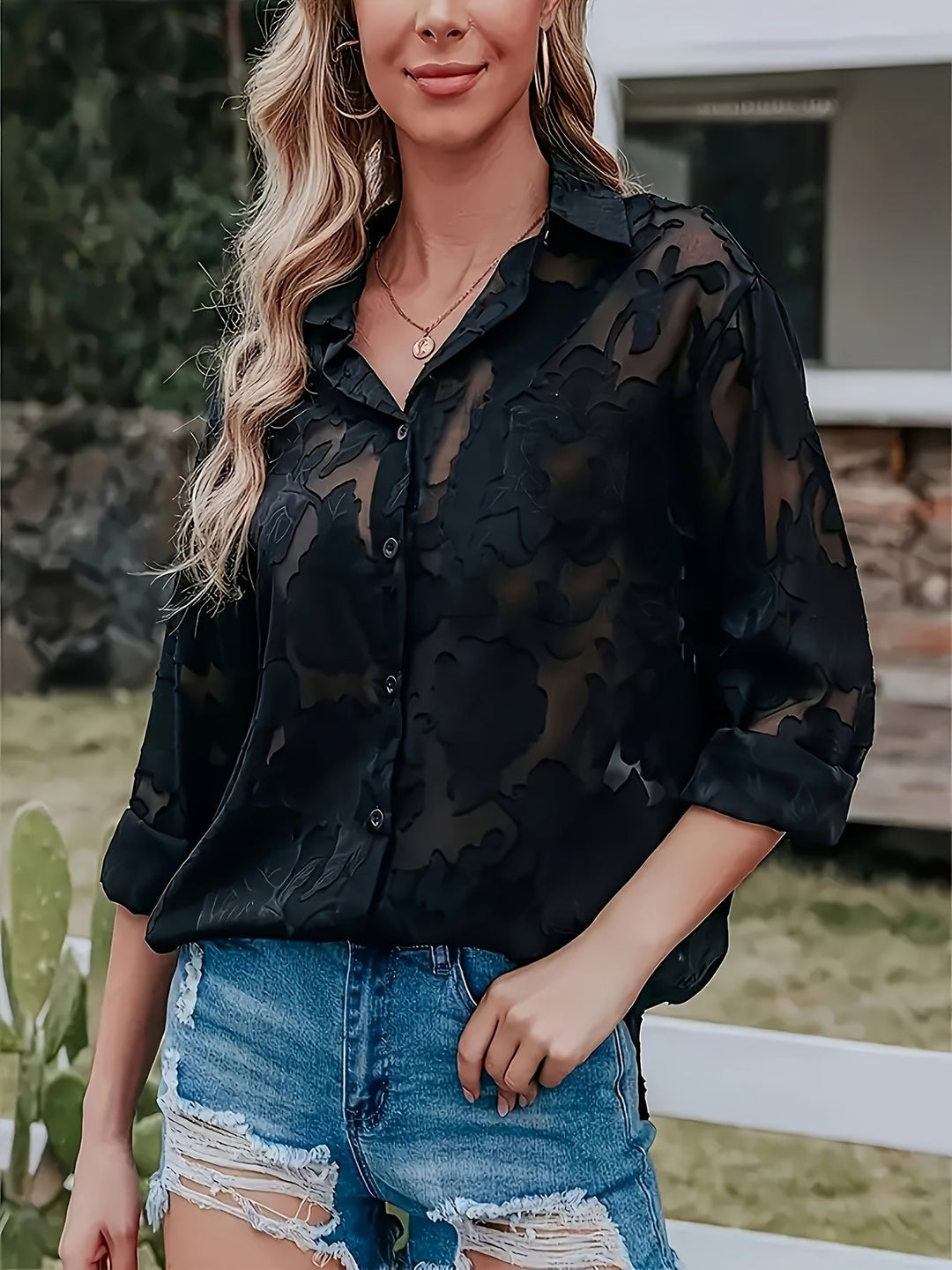 Women's chic jacquard V-neck blouse in a loose fit. Elegant long-sleeve top for versatile style and comfort.