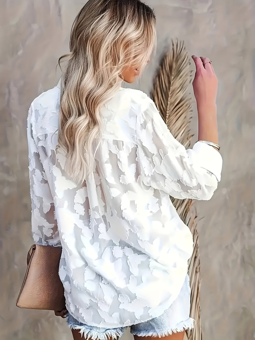 Elegant V-neck jacquard blouse with a chic loose fit, perfect for evening wear or a sophisticated night out.