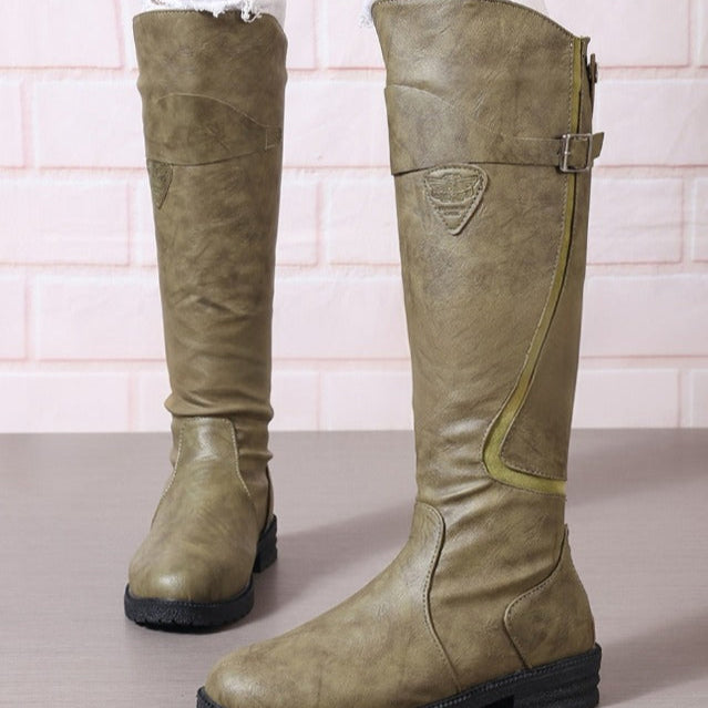 Versatile women's knee-high riding boots with a chic gold buckle & lug sole, offering comfort for fall/winter wear.
