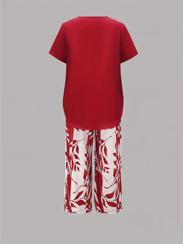 Women's chic leaf print two-piece outfit, perfect for spring/summer casual wear with a relaxed fit.
