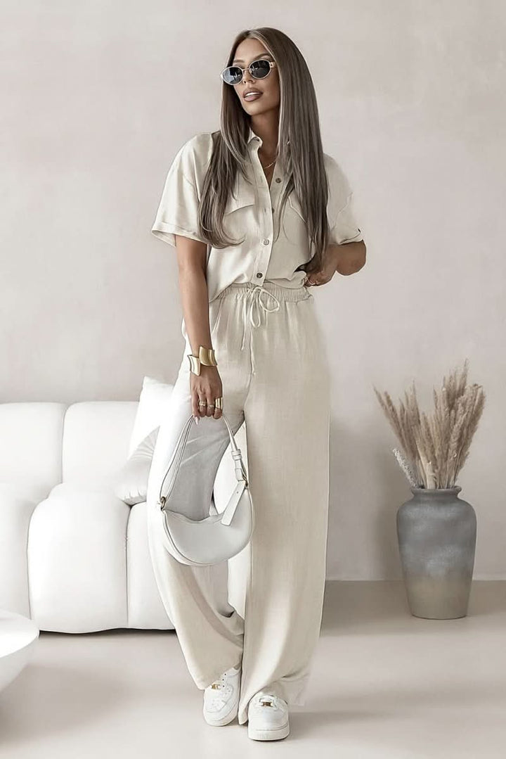 Coordinated women's top & trousers set, versatile for spring/summer fashion.