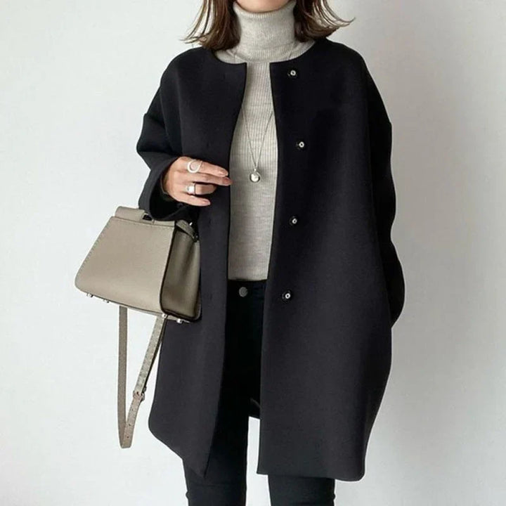 Women's chic oversized button coat. Minimalist design, perfect versatile outerwear for fall & winter fashion.