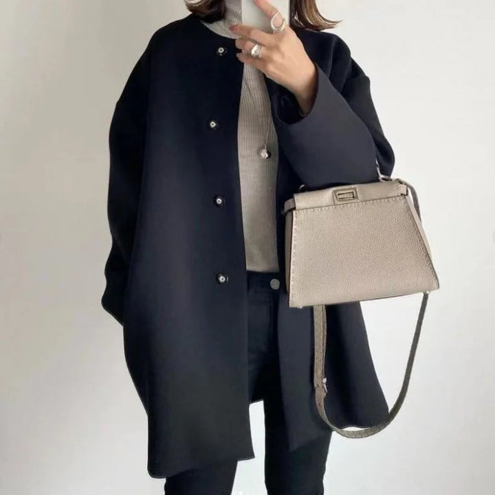Elegant women's oversized button coat. Ideal minimalist fall/winter outerwear & layering piece for chic style.