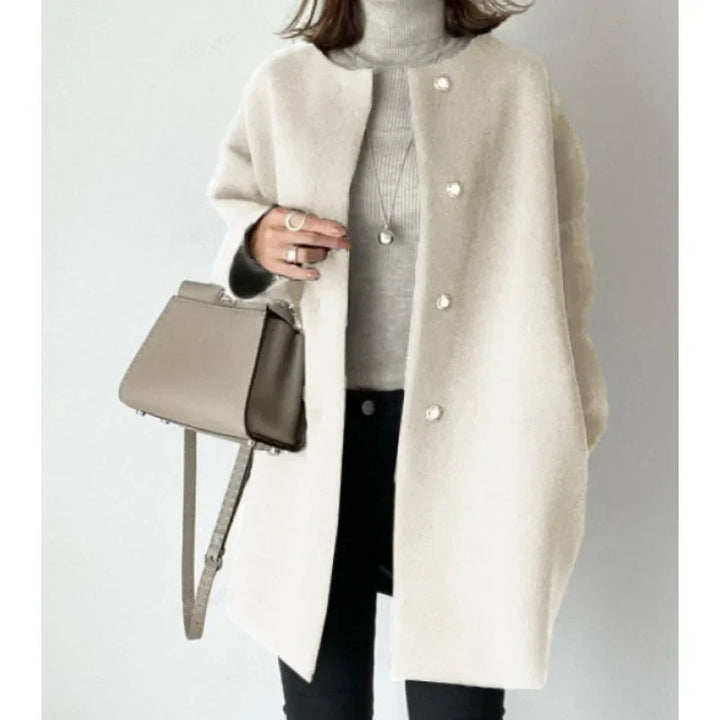 Stylish women's minimalist oversized button coat, a versatile layering piece for casual elegance & fall fashion.