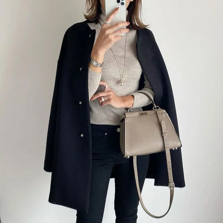 Women's oversized button coat. A chic, minimalist long sleeve outerwear piece, perfect for winter and fall fashion.