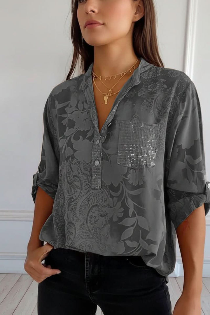 Effortlessly stylish women's printed blouse for spring/fall, offering a comfortable loose fit, long sleeves, and pocket.