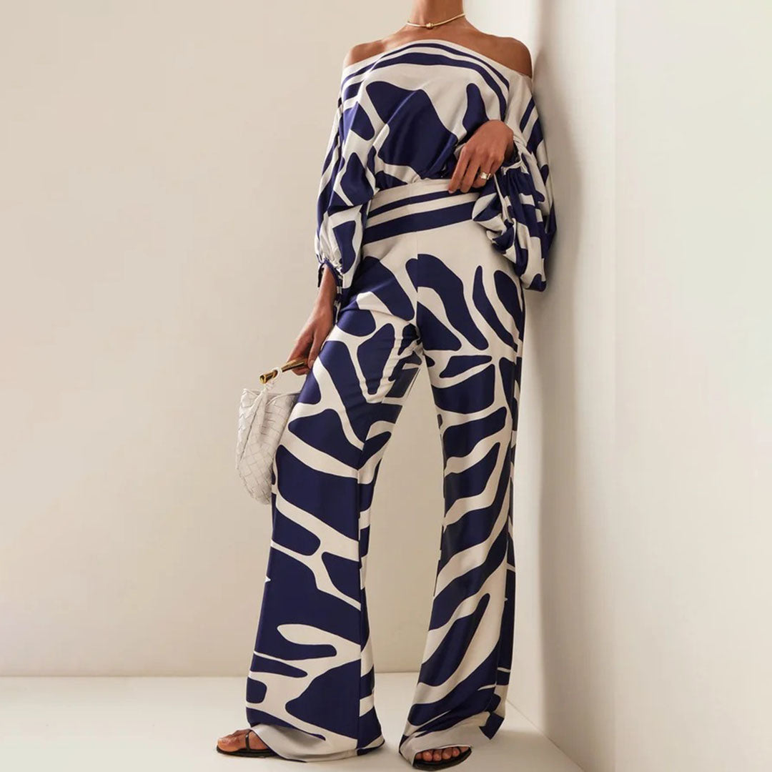 Modern women's fashion: Printed one-shoulder two-piece pants set with flowy wide legs, perfect for summer chic.