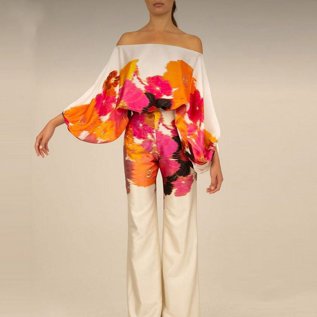 Elegant women's one-shoulder two-piece pants set with an eye-catching abstract print. Ideal for sophisticated resort wear.