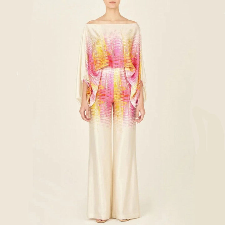 Women's stylish two-piece set: one-shoulder top and wide-leg pants in a unique abstract print for a fashion statement.