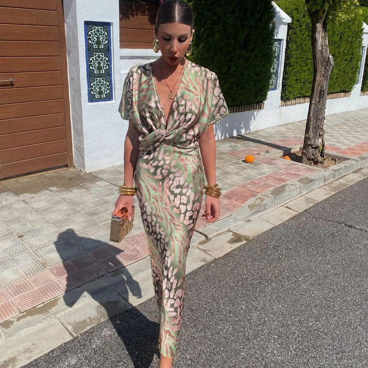 Women's chic printed twist front maxi wedding guest dress with V-neck, perfect for elegant special occasions.