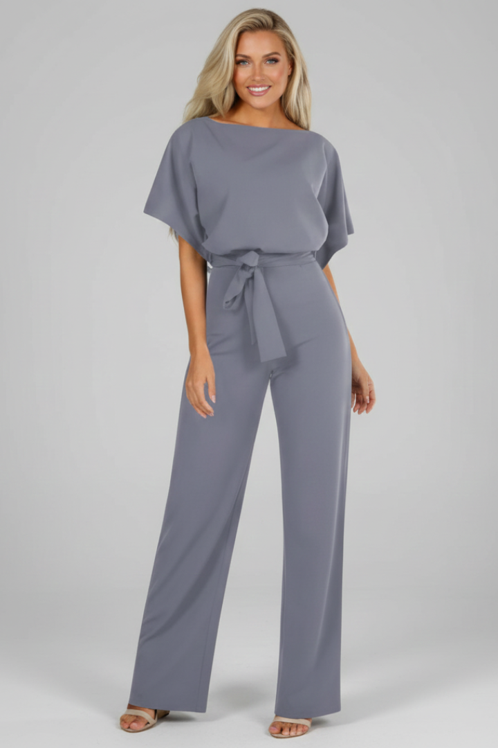 Women's chic short sleeve jumpsuit with flattering waist tie, perfect for elegant spring/summer fashion.