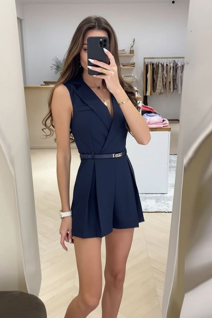 Stylish women's apricot sleeveless romper with belt. Ideal chic summer outfit.