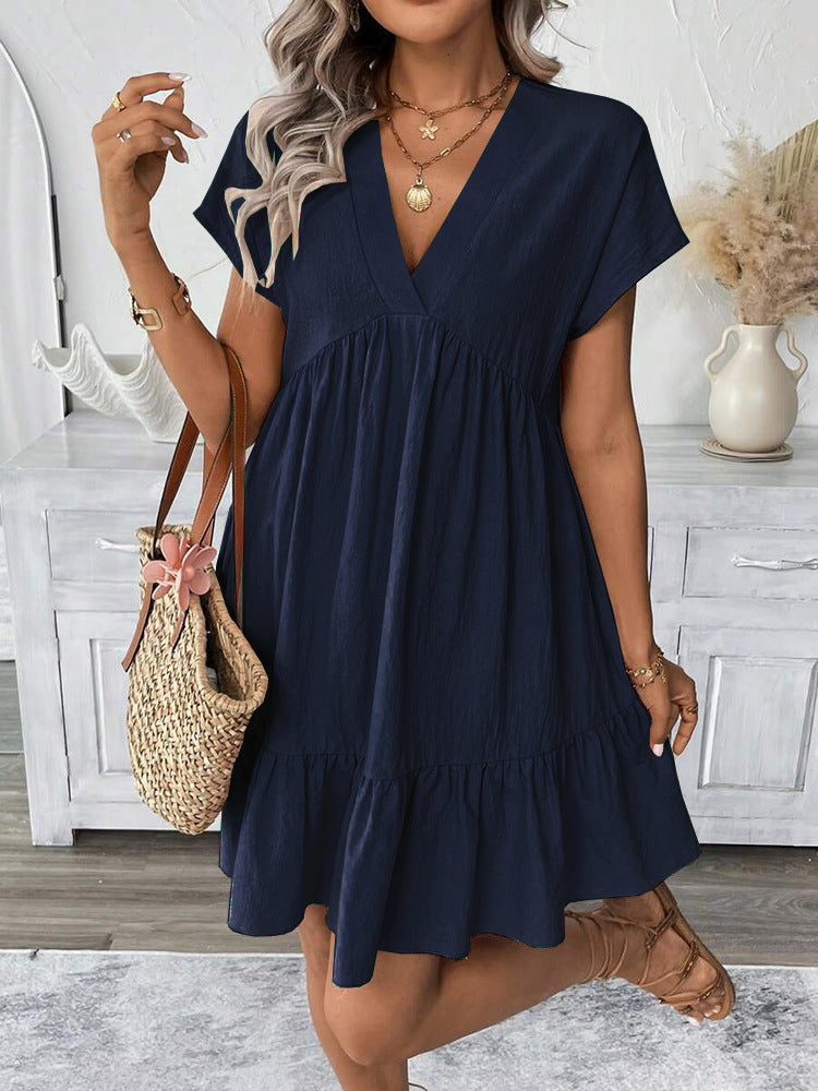 Relaxed fit chic women's summer mini dress, sleeveless with a playful ruffle hem, ideal for warm weather.