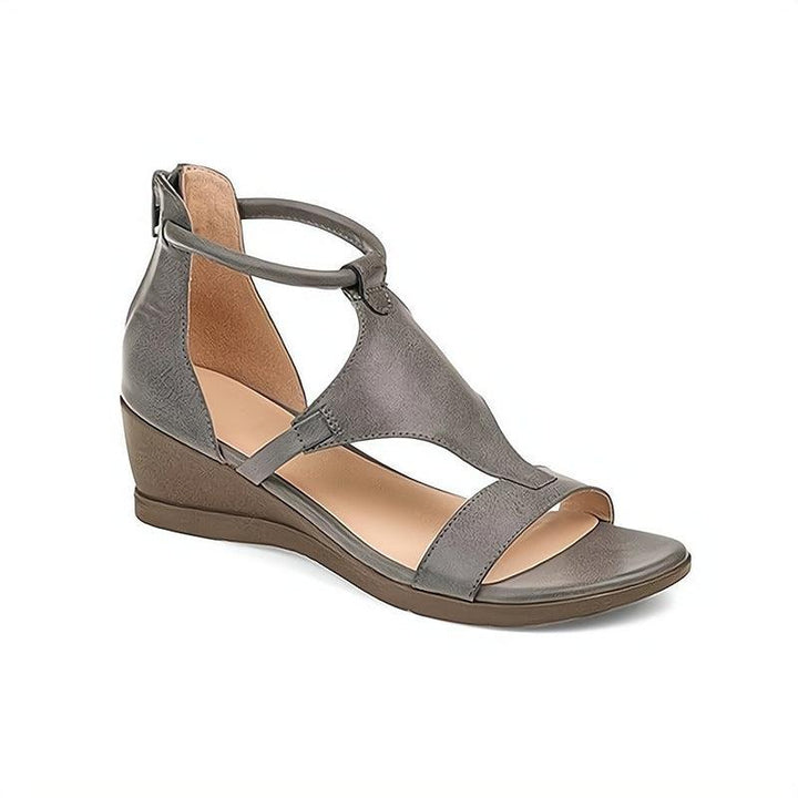 Simple and comfortable women's slip-on flat sandals. Essential everyday summer shoes with an open-toe design.