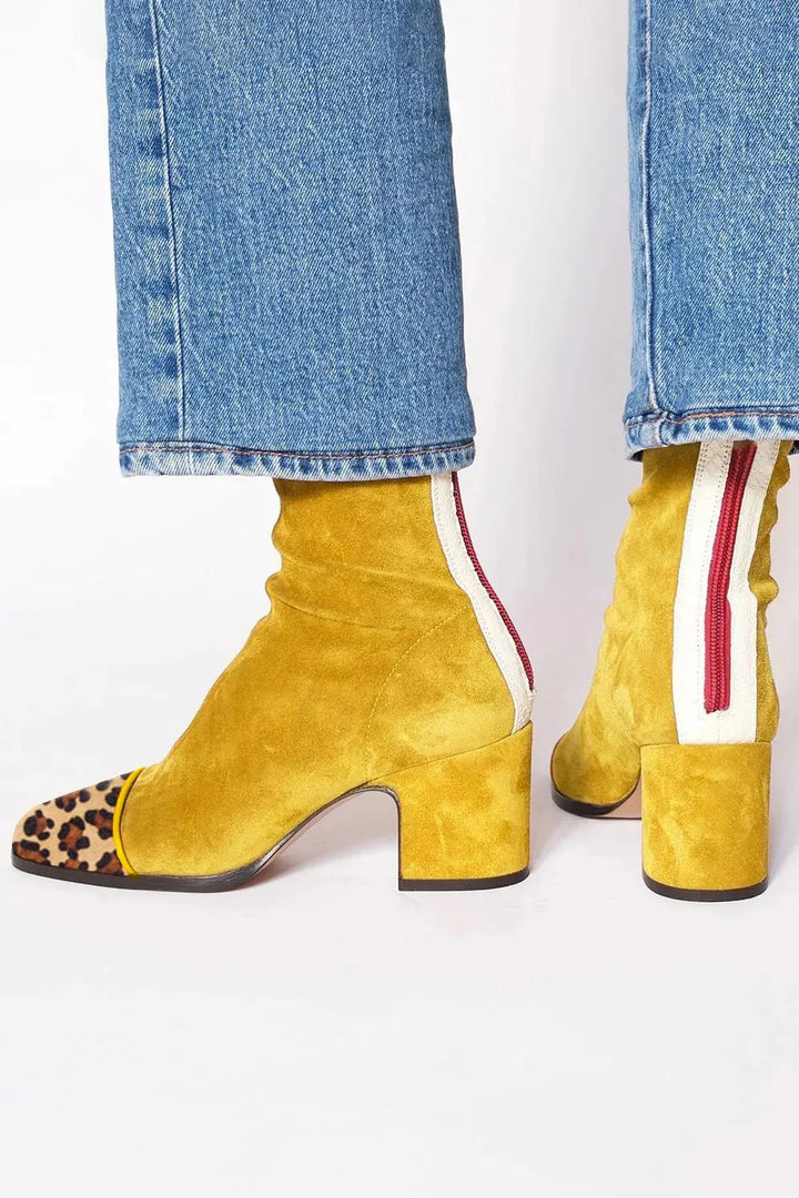 Women's stylish square toe heeled boots, featuring a block heel, great for fall and winter fashion.
