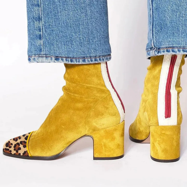 Fashionable women's heeled boots with a contemporary square toe and durable block heel design.