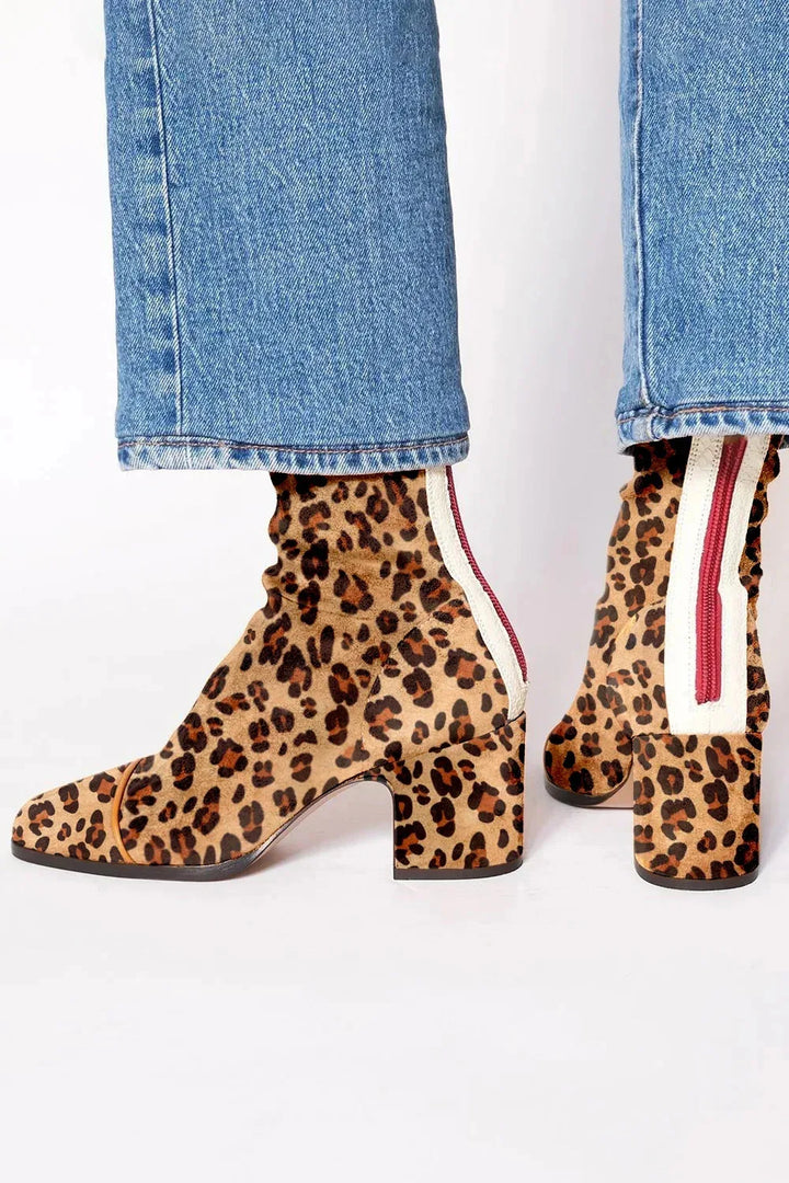 Comfortable women's square toe ankle boots with a chic block heel, ideal for trendy footwear.