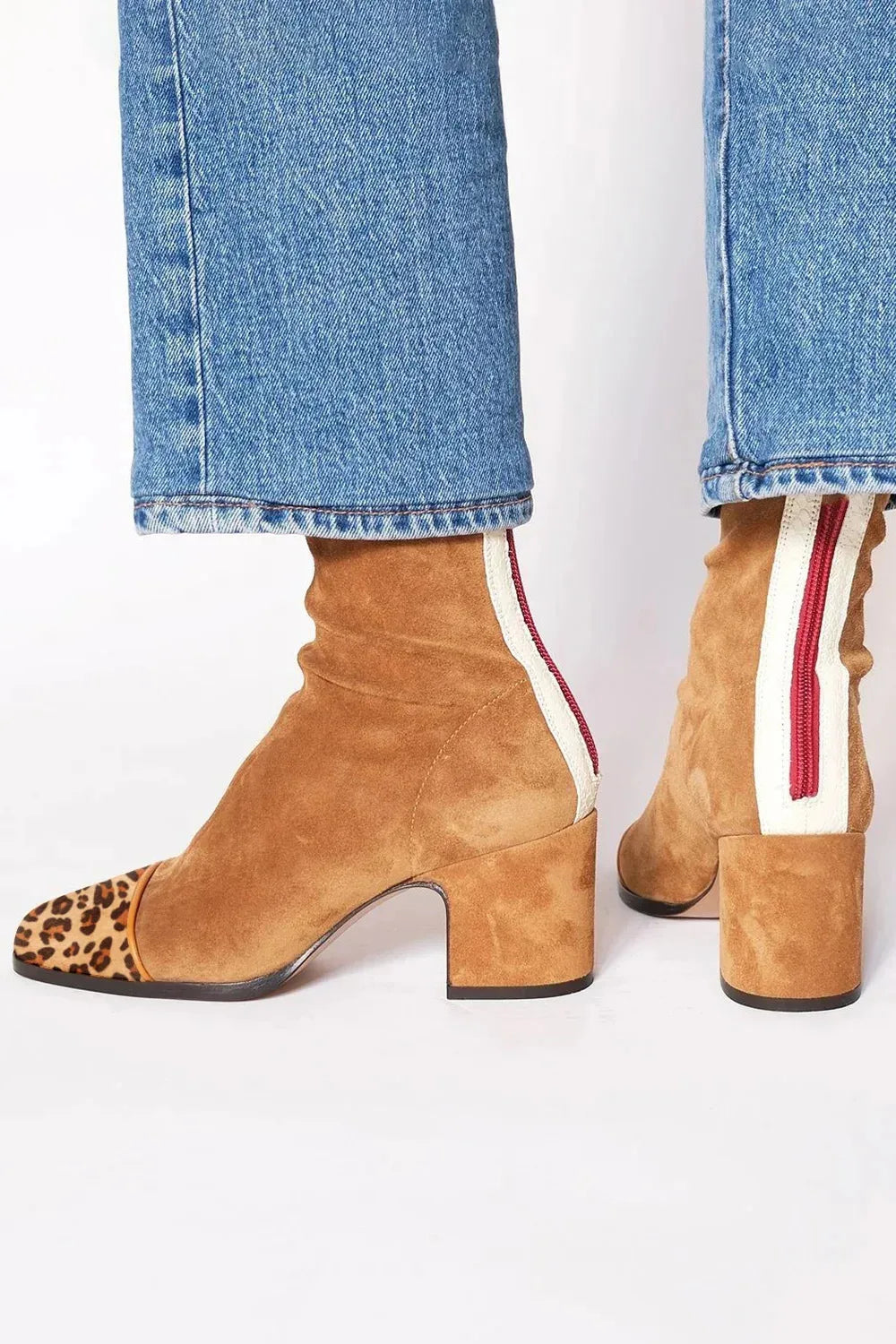 Chic women's square toe boots with a comfortable block heel, perfect for stylish winter outfits.