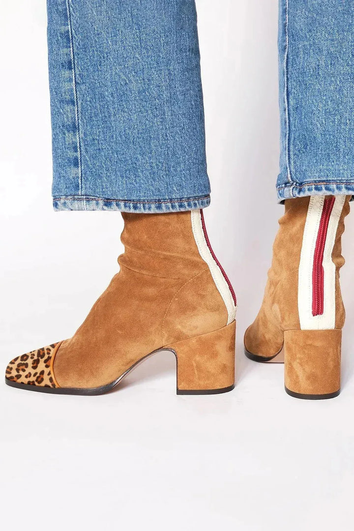 Chic women's square toe boots with a comfortable block heel, perfect for stylish winter outfits.
