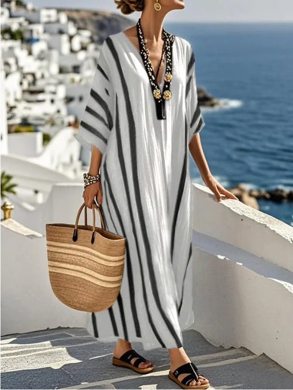 Stylish women's kaftan dress. Bohemian striped long maxi, perfect for elegant summer, beach, or resort fashion.