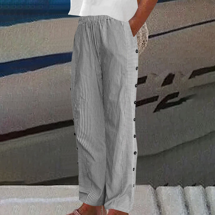 Trendy striped spring/summer pants for women, featuring chic button accents. Stylish everyday bottoms.