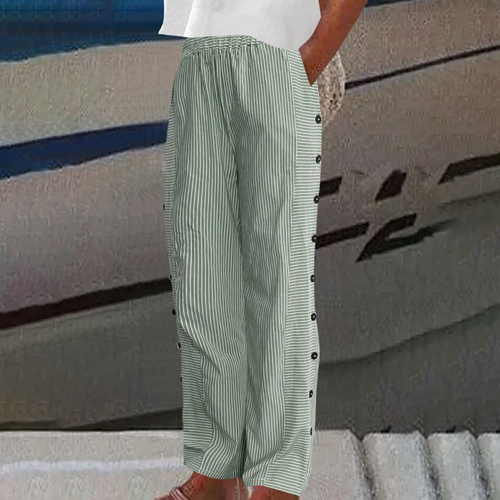 Stylish women's striped pants with unique button accents. Comfortable everyday fashion bottoms.