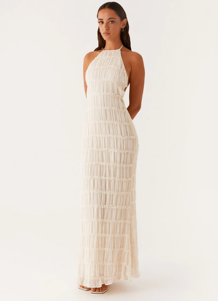 Women's chic textured halter maxi wedding guest dress, elegant for special occasions.