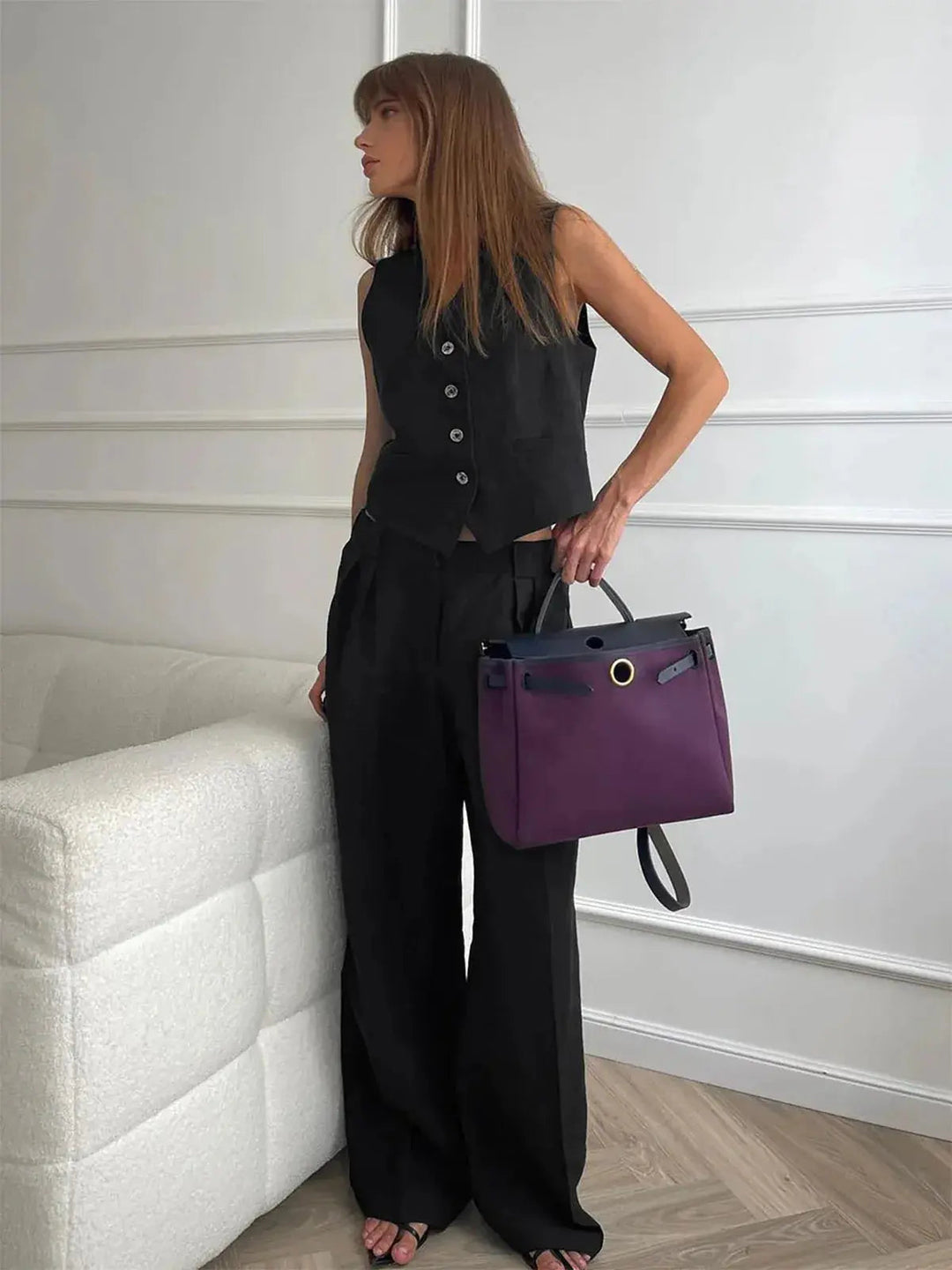 Fashionable women's two-piece set, combining a modern waistcoat and classic wide-leg trousers for daily wear.