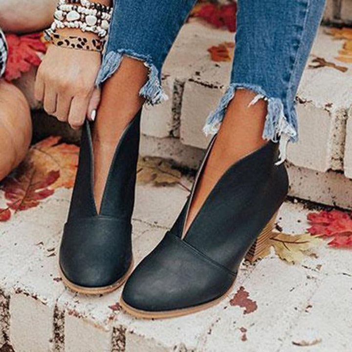 Comfortable women's V-cut ankle boots. Versatile for casual or dressy looks, ideal everyday footwear.