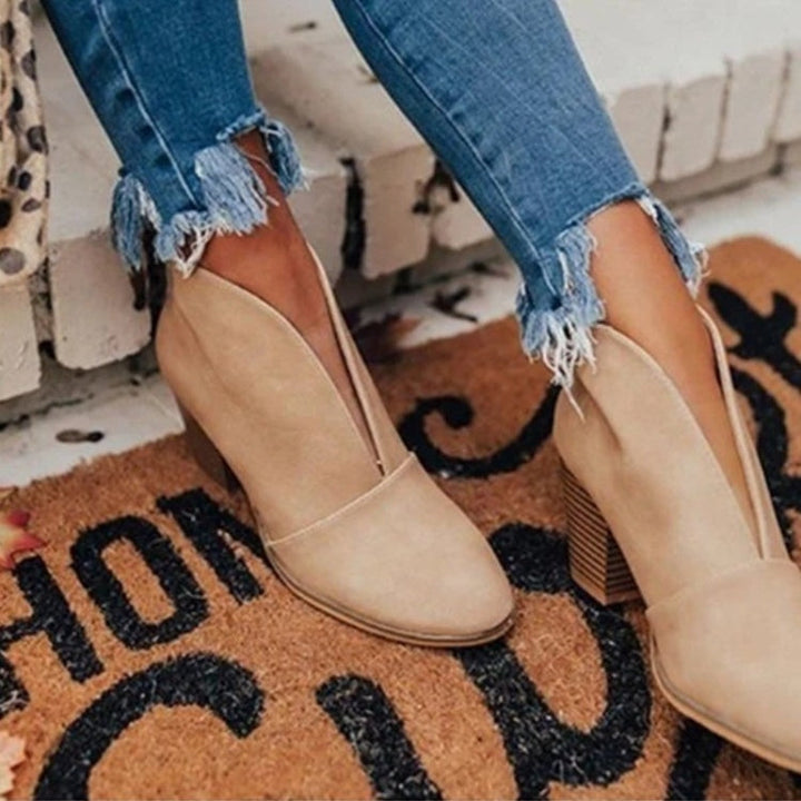 Stylish women's ankle boots featuring a unique V-cut design. Chic & comfortable for autumn and winter outfits.