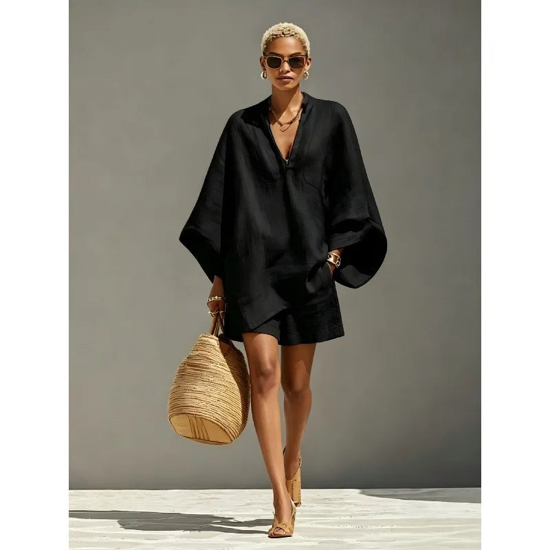 Relaxed fit women's two-piece shorts set with V-neck top & batwing sleeves. Ideal for chic summer lounge.