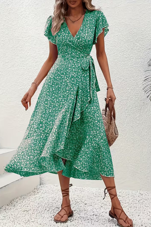 Asymmetrical hem detail of the stylish women's V-neck floral midi dress. Unique casual chic.