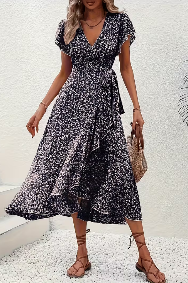 Back view of the elegant women's V-neck floral midi dress, showing its comfortable fit. Summer style.
