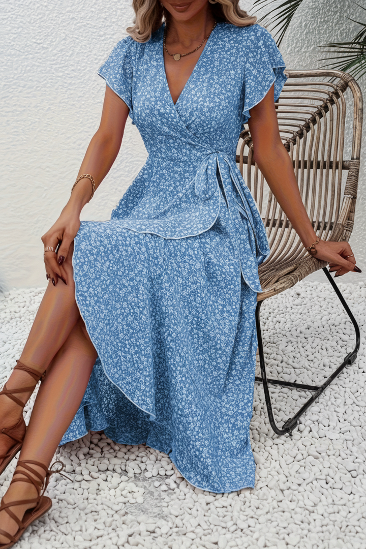 Women's V-neck floral midi dress in natural light, emphasizing its vibrant floral pattern.