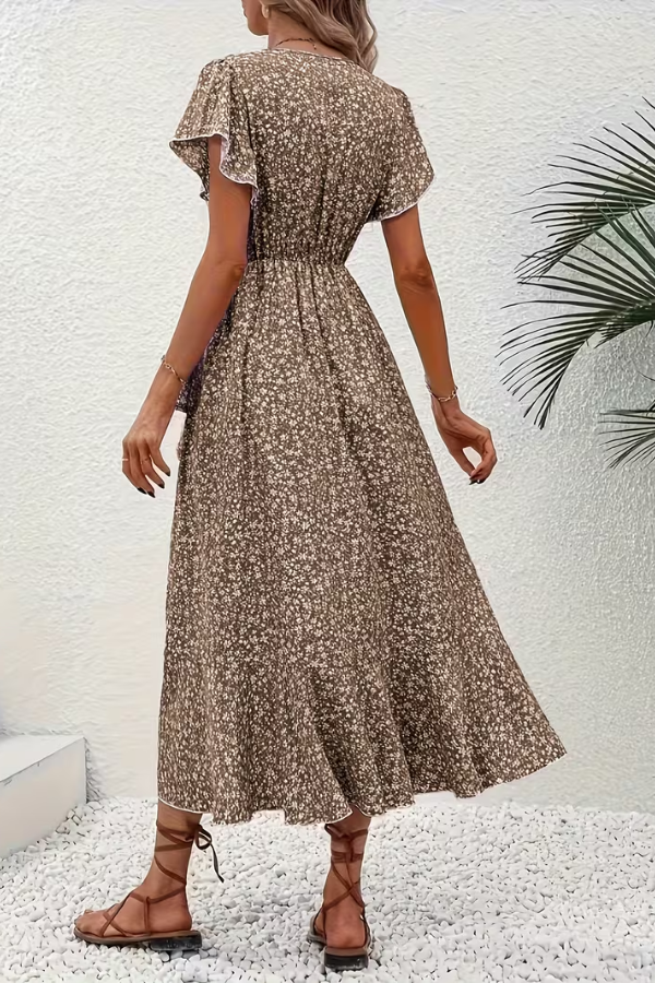 Lightweight V-neck floral midi dress for women, graceful side profile. Ideal spring/summer fashion.