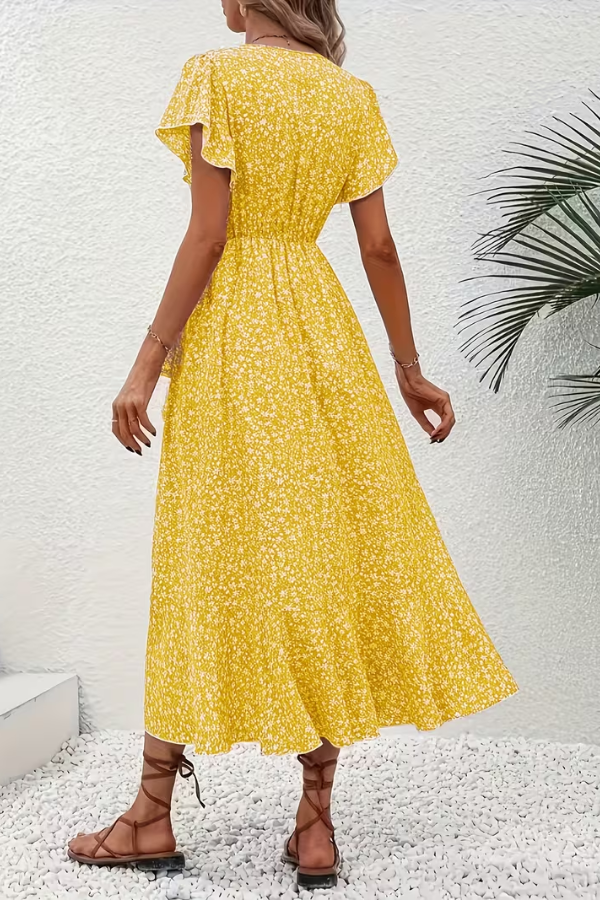 Elegant V-neck floral midi dress for women, styled with heels for a sophisticated occasion.