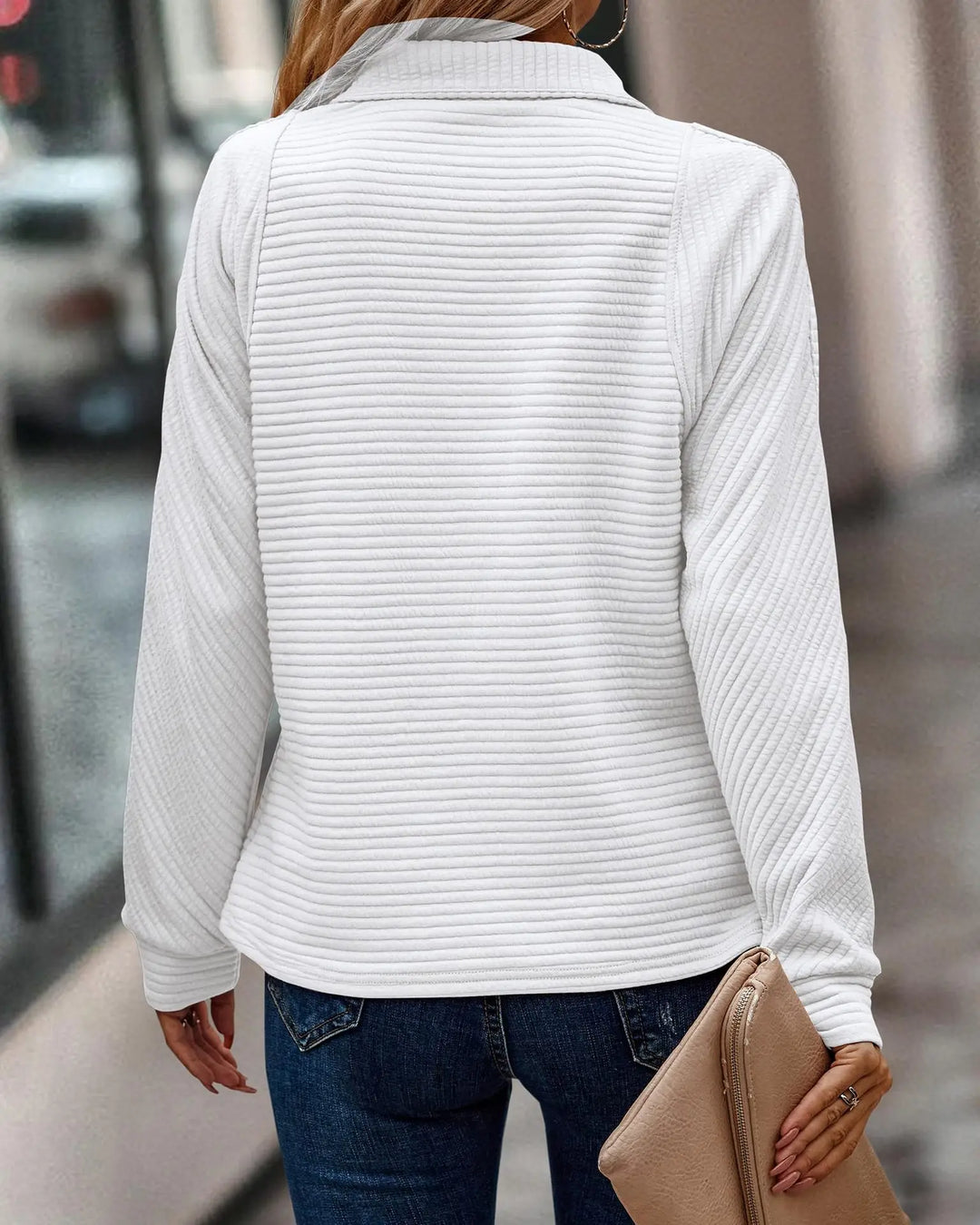 Women's elegant V-neck sweater with a chic front zipper. Comfortable & stylish long-sleeve pullover.