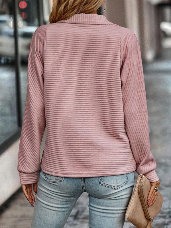 Comfortable & elegant women's V-neck zippered sweater. Soft long-sleeve pullover for everyday wear.