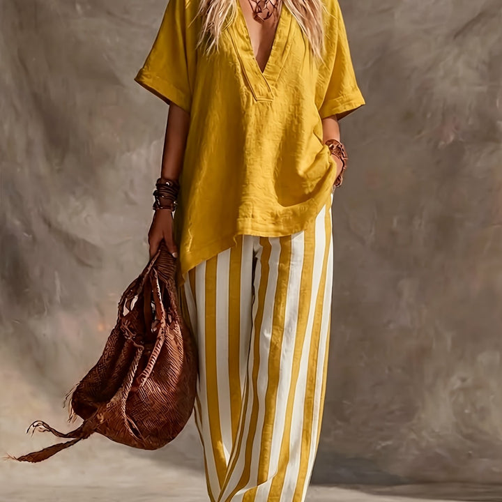Chic women's two-piece set with a V-neck top and striped high-waisted wide leg pants, a versatile summer outfit.