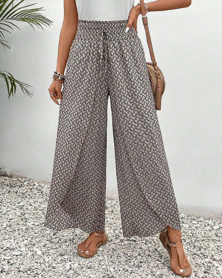 Women's chic wide leg trousers, relaxed fit, with a stylish geometric print. Comfortable & versatile fashion pants.