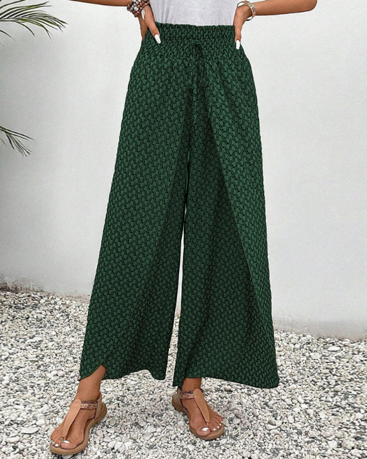 Relaxed fit women's wide leg trousers in a striking geometric pattern. Stylish, comfortable, and versatile fashion.