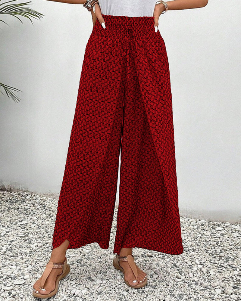Chic women's wide leg trousers, designed for a relaxed fit, showcasing an eye-catching geometric print.