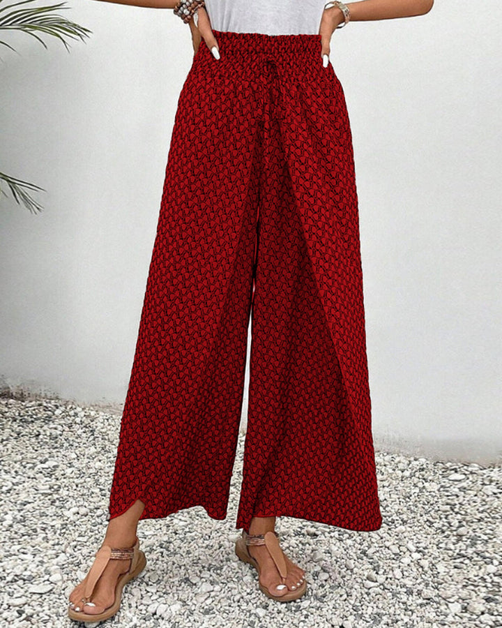 Chic women's wide leg trousers, designed for a relaxed fit, showcasing an eye-catching geometric print.