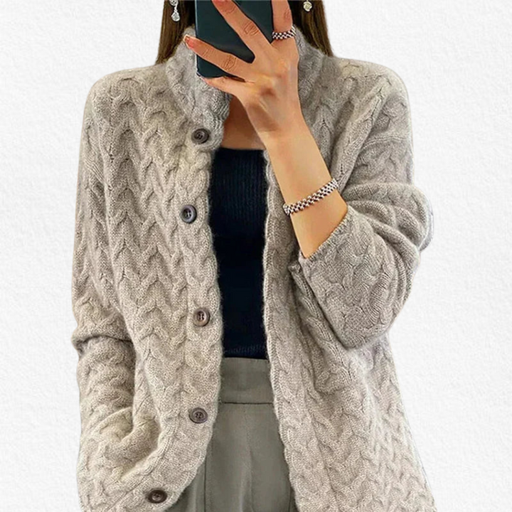 Cozy women's cable knit button-front cardigan, a stylish chunky long-sleeve layering piece for everyday wear.