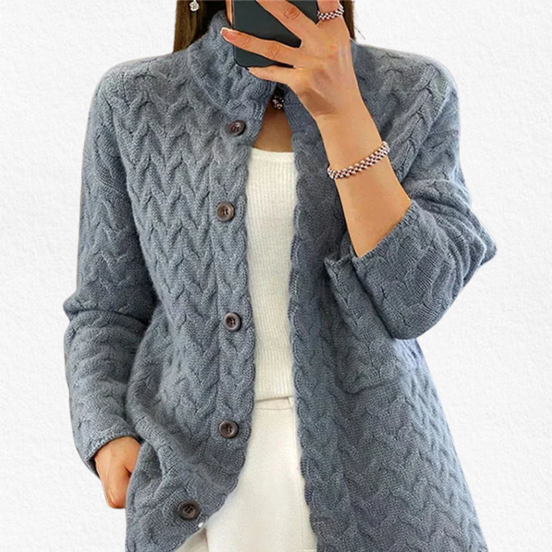 Chunky cable knit women's cardigan featuring a button front, long sleeves, perfect for winter fashion.