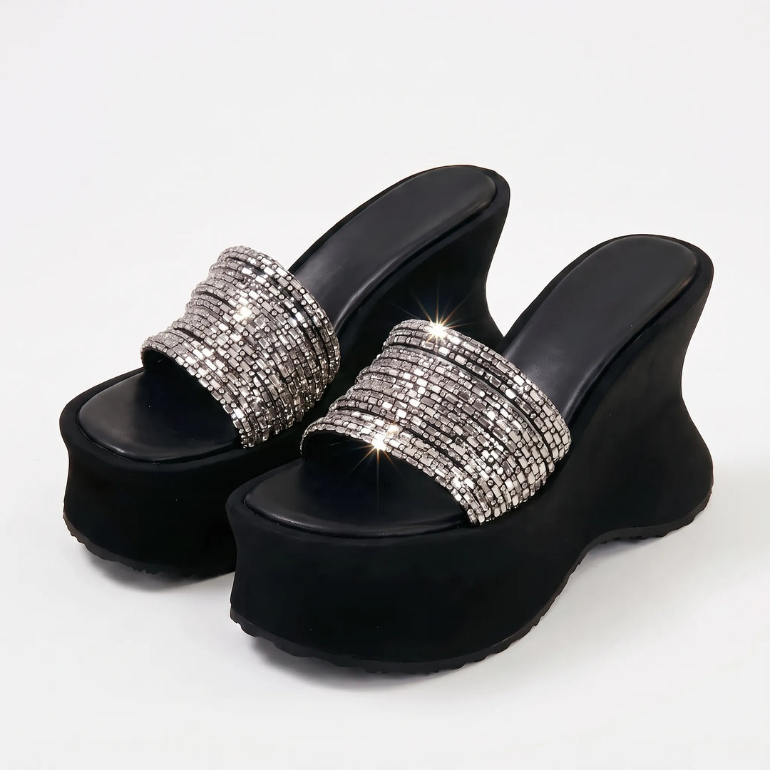 Elevated women's chunky platform slip-on sandals. High heel footwear for trendy summer & evening looks.